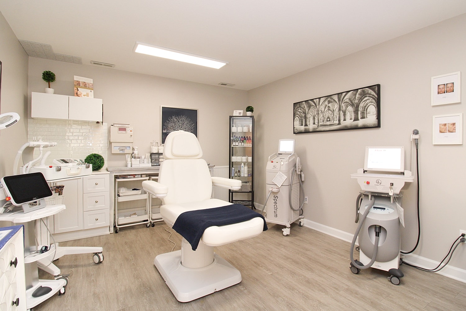Modern aesthetic treatment room with equipment.
