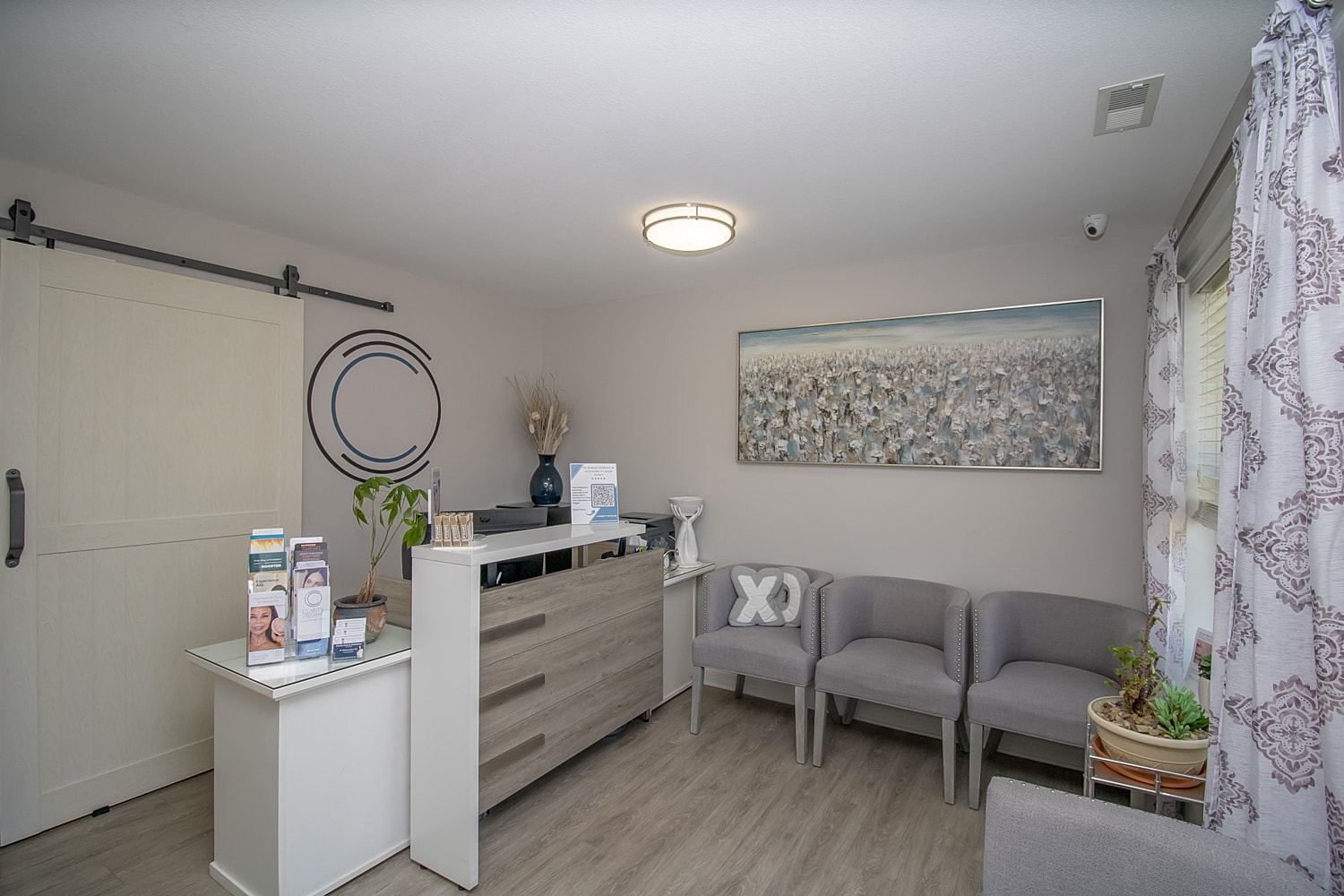 Modern reception area with seating and decor.