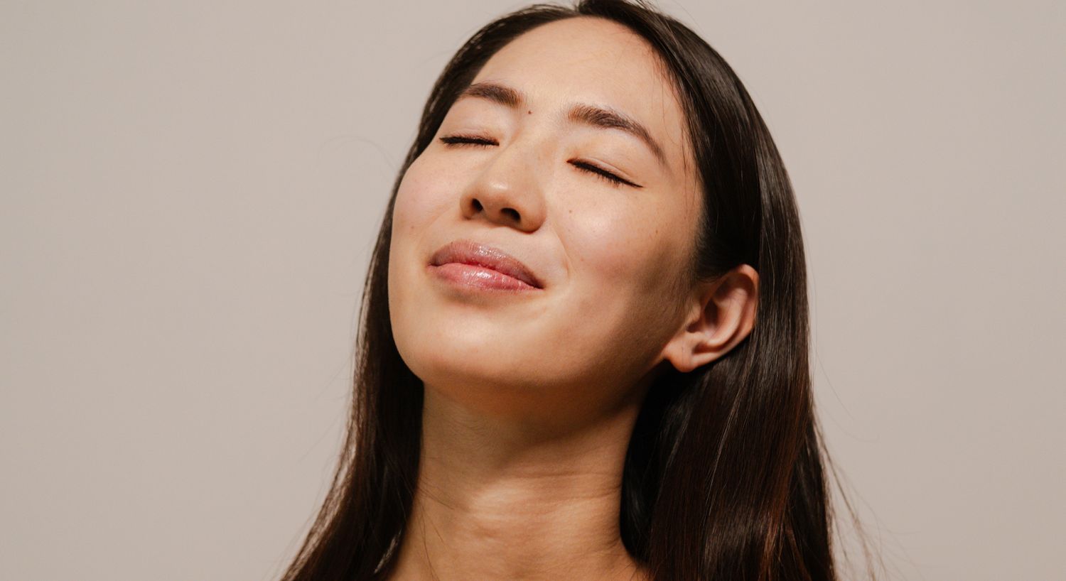 Woman with closed eyes and serene expression.