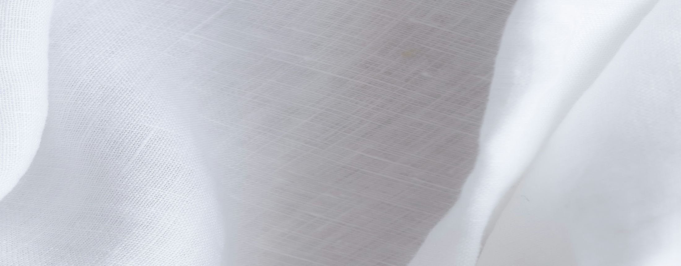 Textured white fabric draped gracefully.