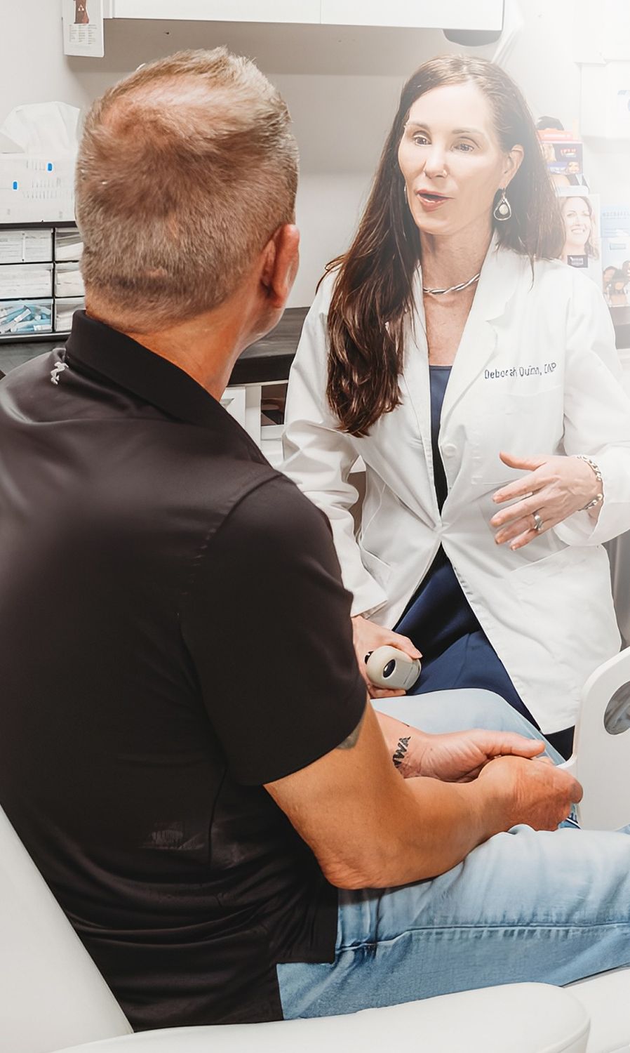 Consultation between doctor and patient in office.