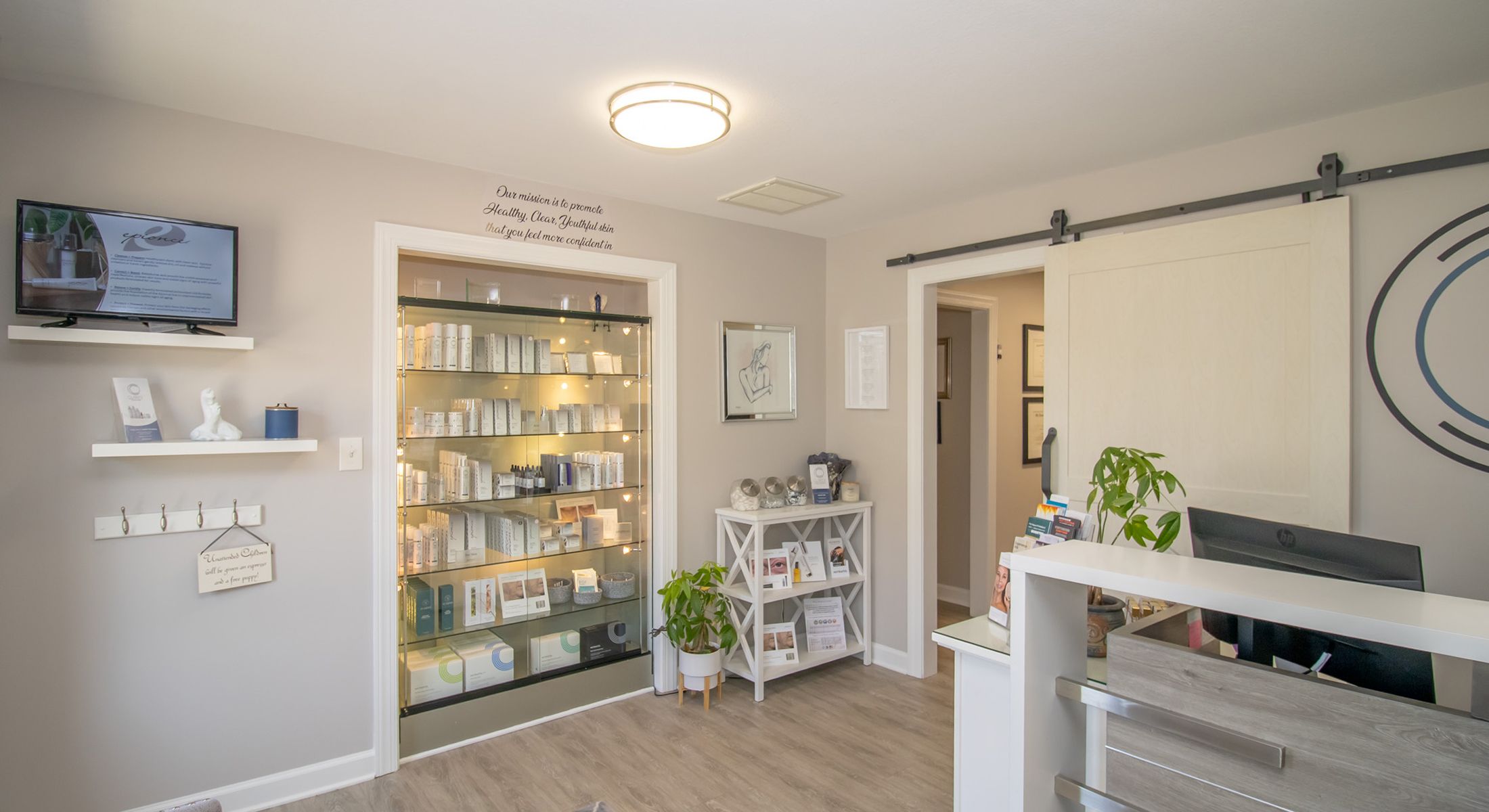 Spa reception area with skincare products displayed.